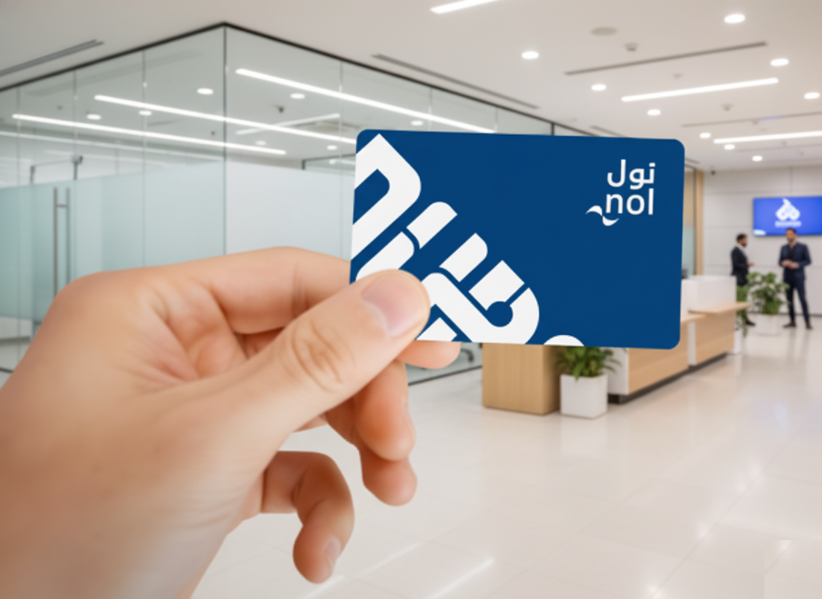 Commuter tapping a Nol card at a Dubai Metro gate with green light confirmation